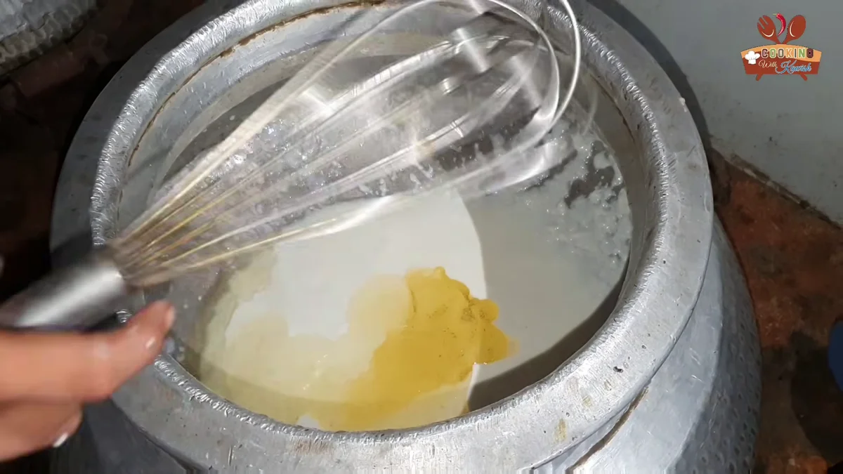 Yogurt and oil whisked together for the korma base