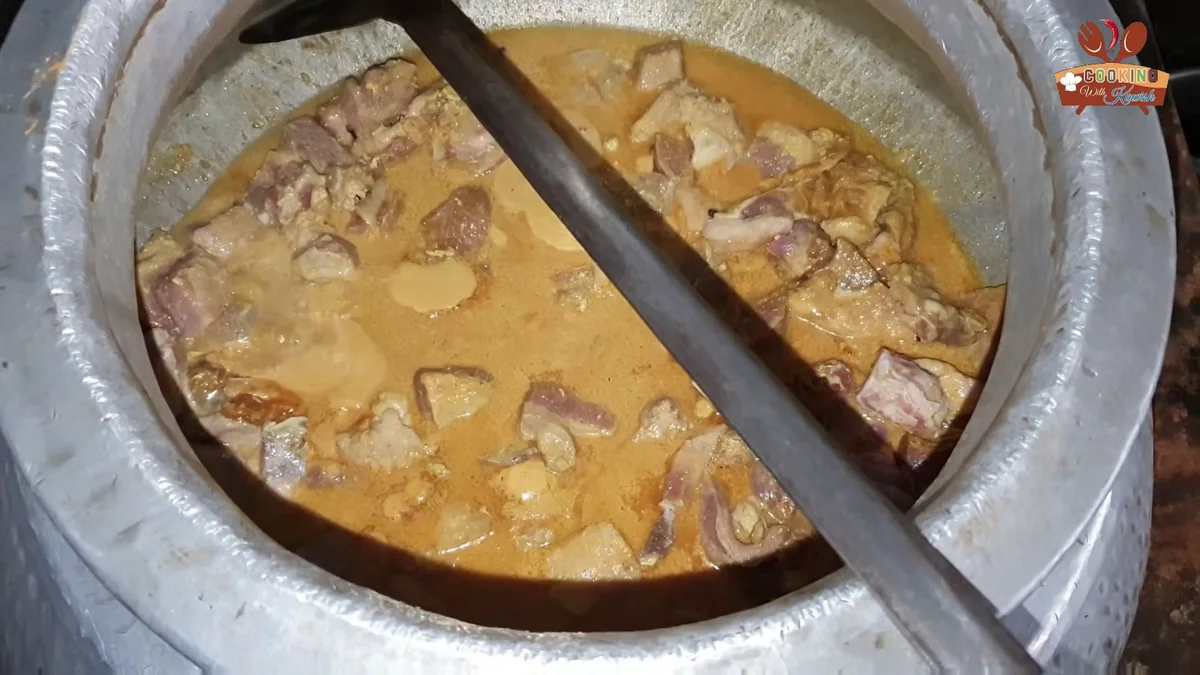 Beef korma cooking in a pale yogurt gravy