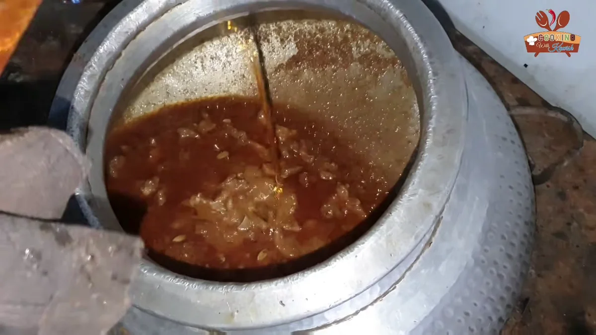 Extra oil poured into the korma for the final bhunai
