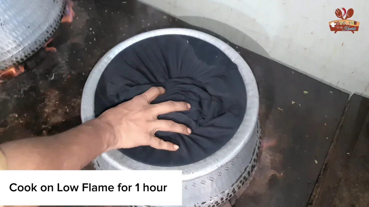 Deg covered with a cloth to cook on a low flame for one hour