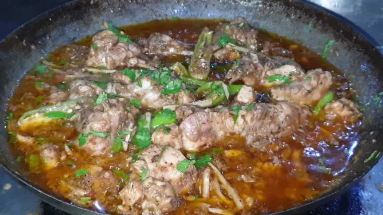 Lahori chicken karahi with green chillies and ginger in a karahi