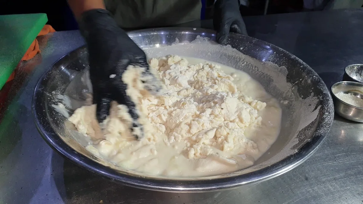 Mixing the poori paratha dough by hand