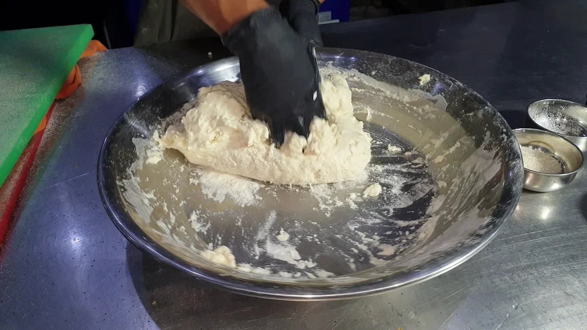 Kneading the dough in the bowl