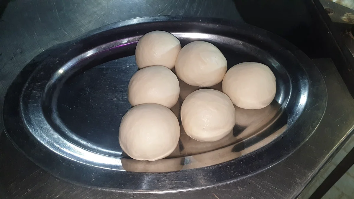 Dough balls on a steel tray