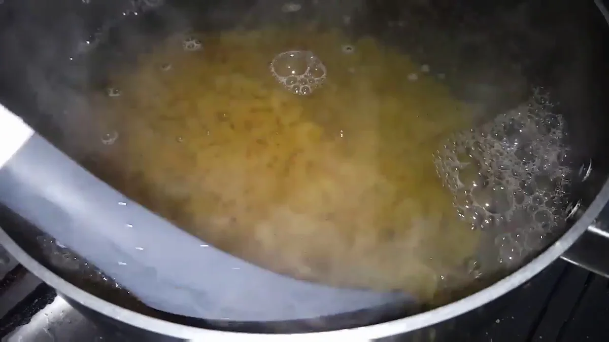 Macaroni boiling in a pot of water