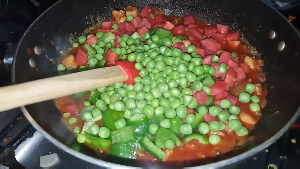 Peas and carrot added to the chicken vegetable mix
