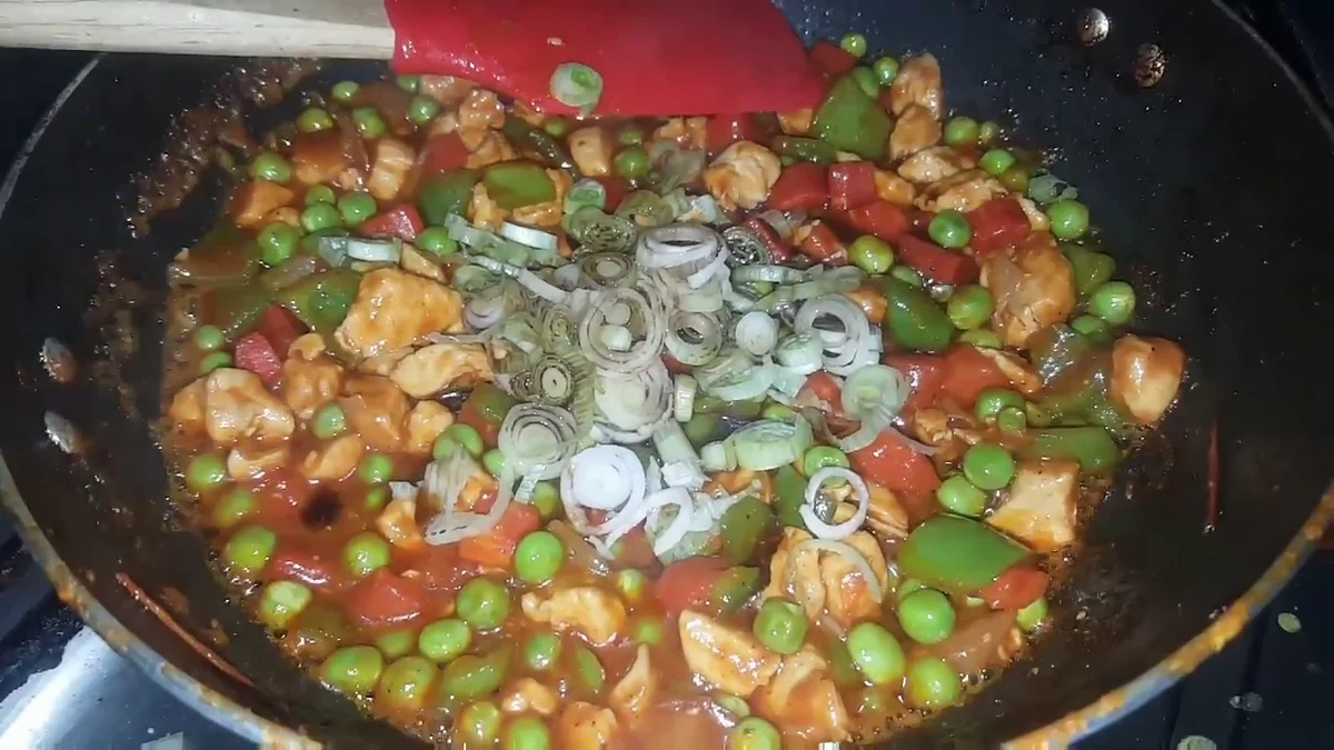Spring onions added to the macaroni sauce