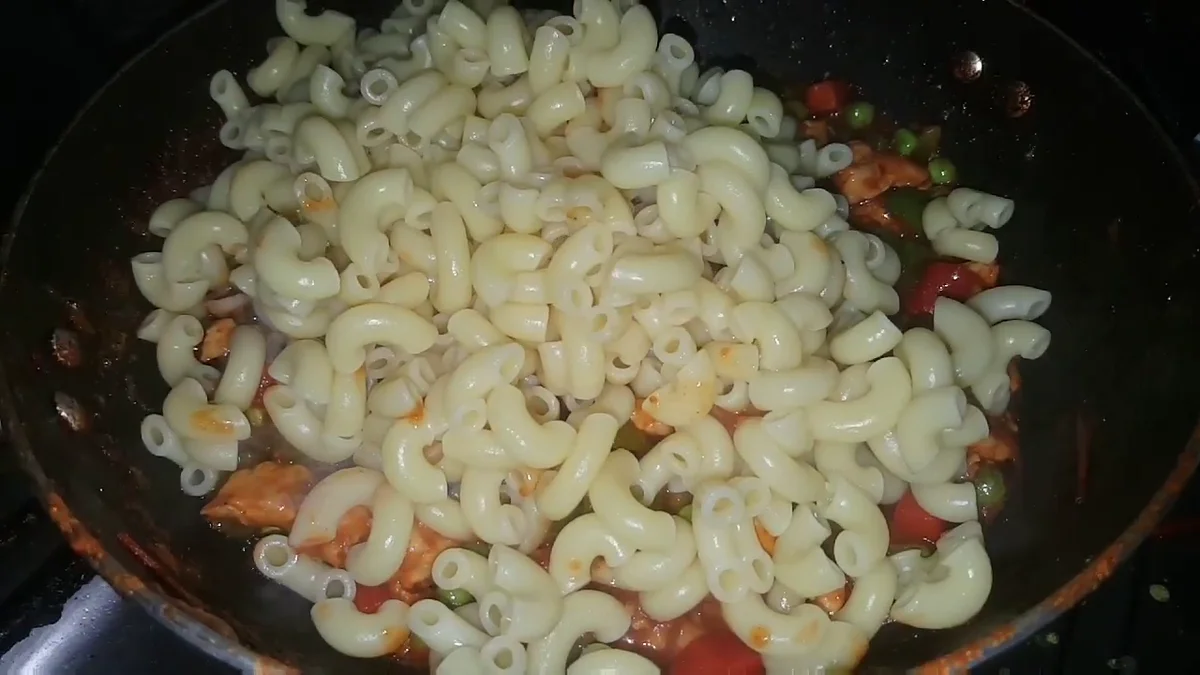 Boiled macaroni added to the chicken and vegetables