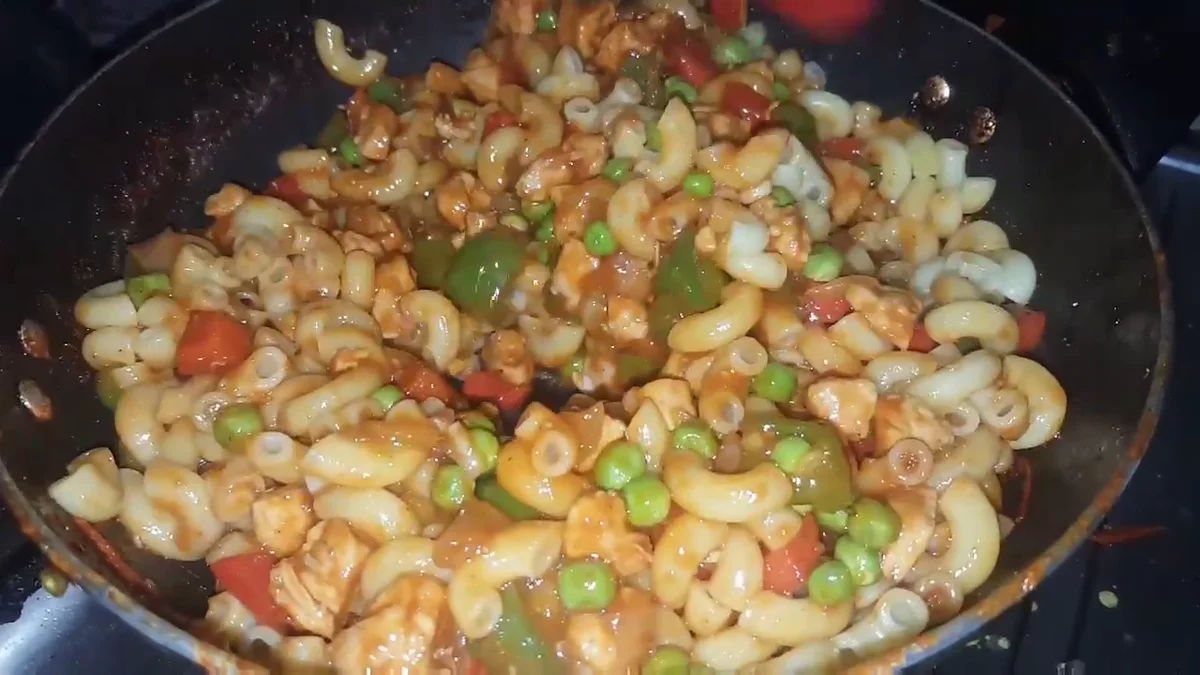 Macaroni tossed with the chicken and sauce