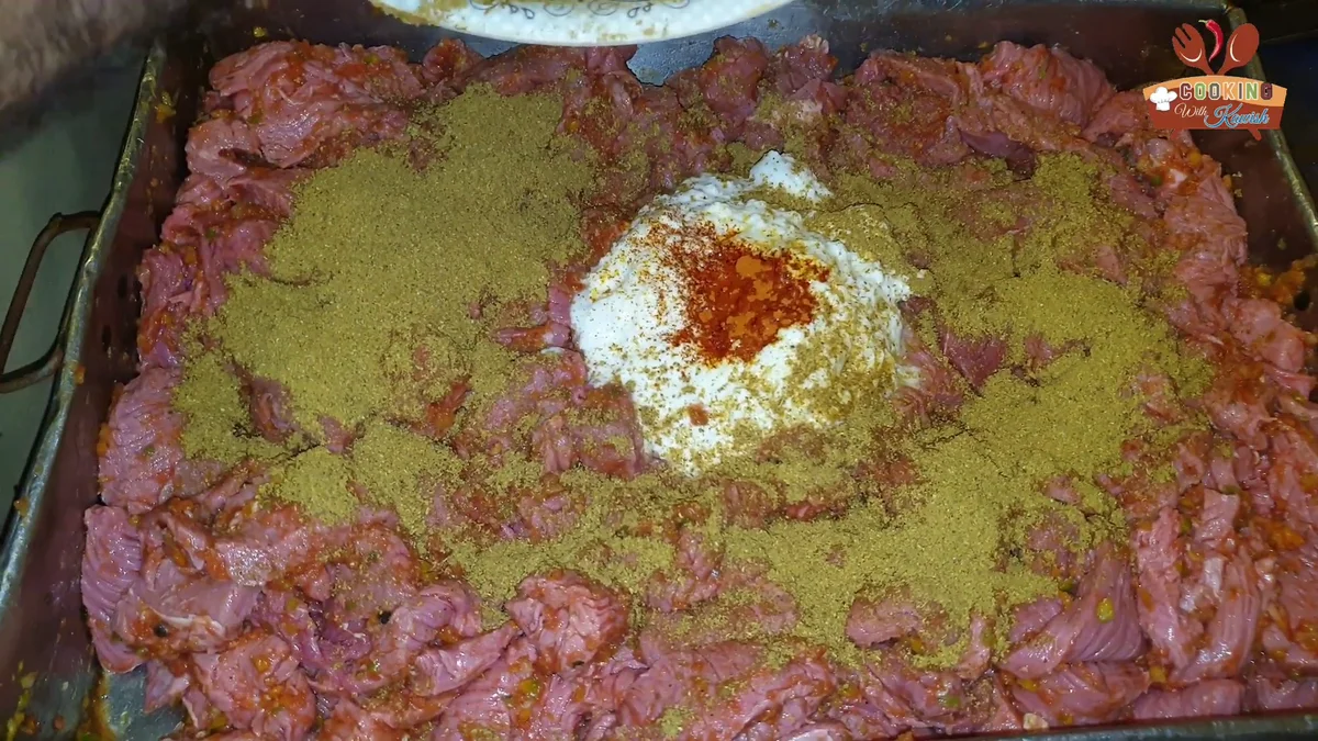 Ground green spice mix sprinkled over the beef strips