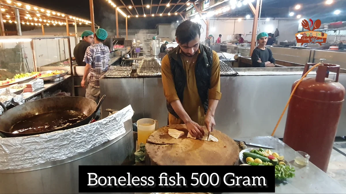 Boneless fish, 500 grams, being cut at the Shinwari stall