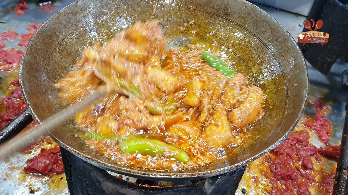 Fish karahi simmering with green chillies and thick gravy