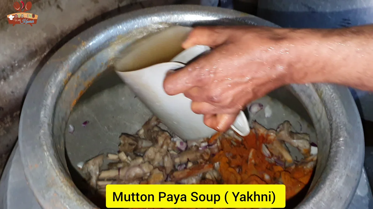 Mutton paya yakhni being added to the pot