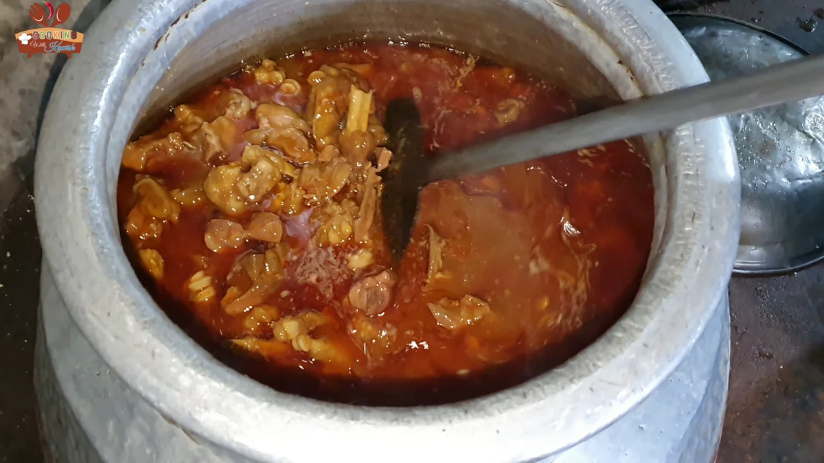 Finished kunna paya in the pot with mutton and paya in a red gravy