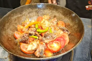 Green chillies added with tomatoes before covering