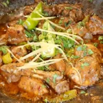 Masaledar chicken karahi finished with ginger, green chilli and coriander