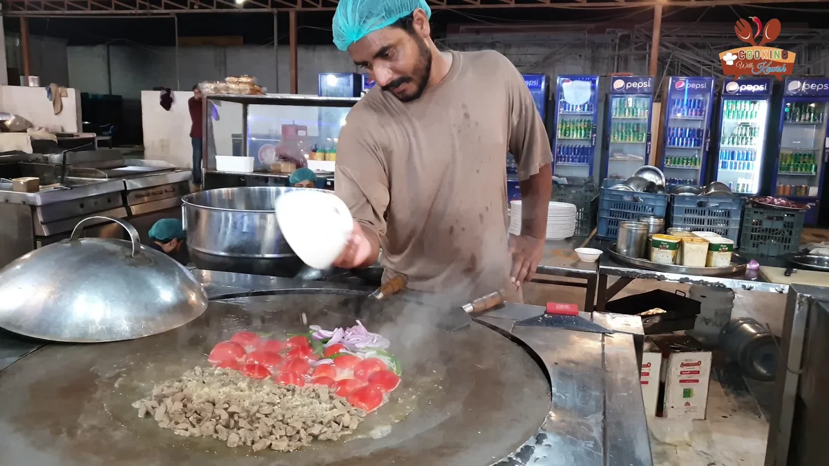 Cook covering the tawa with a lid while the tomatoes soften