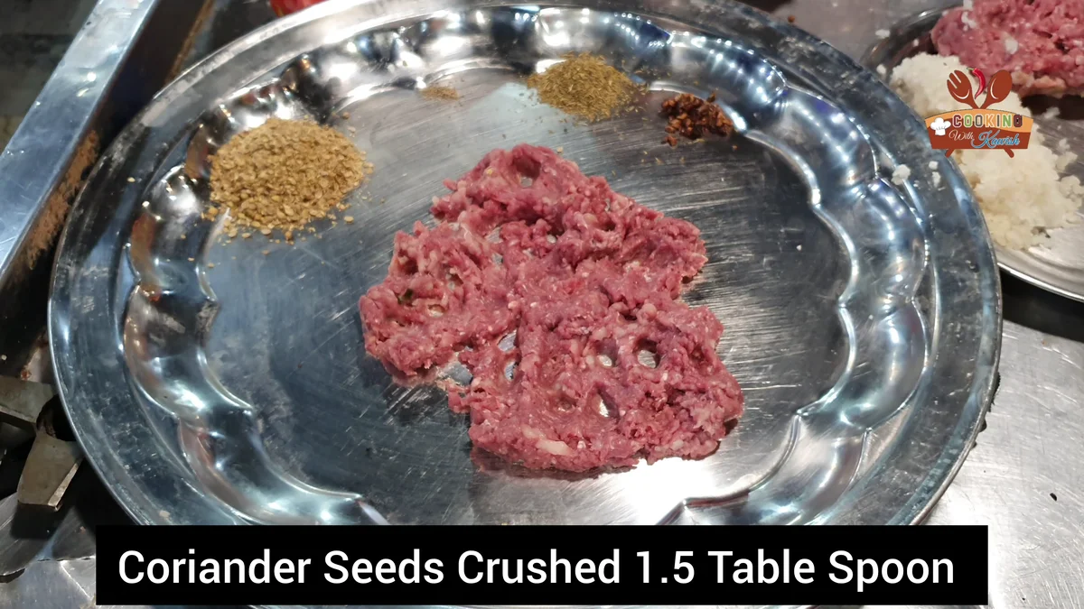 Crushed coriander seeds in a plate beside the mutton