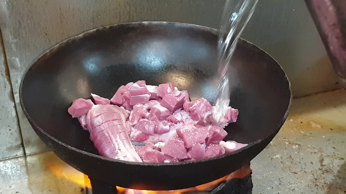 Water poured over the mutton in the karahi