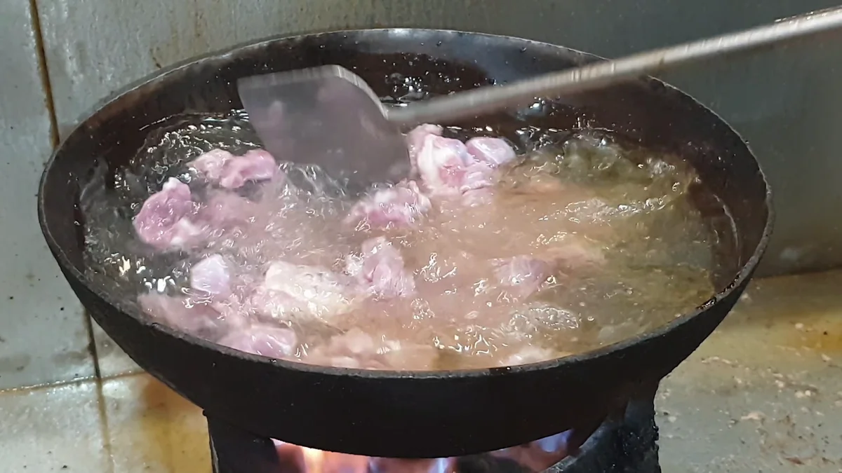 Mutton boiling in the karahi