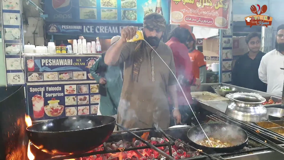 Cook stirring the karahi at the Khan Quetta stall