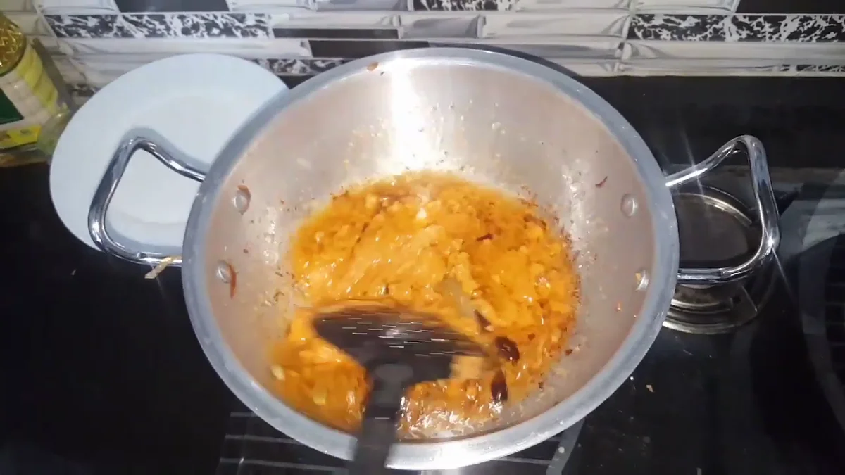 Spiced gravy cooking in the karahi