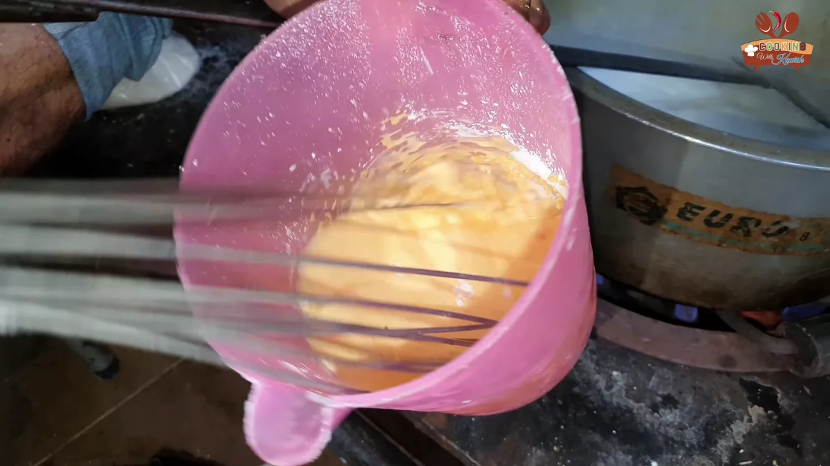 Whisking the custard powder into warm milk