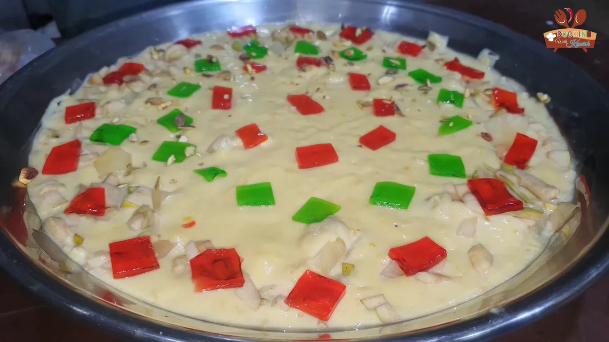 Red and green jelly cubes on top of the trifle