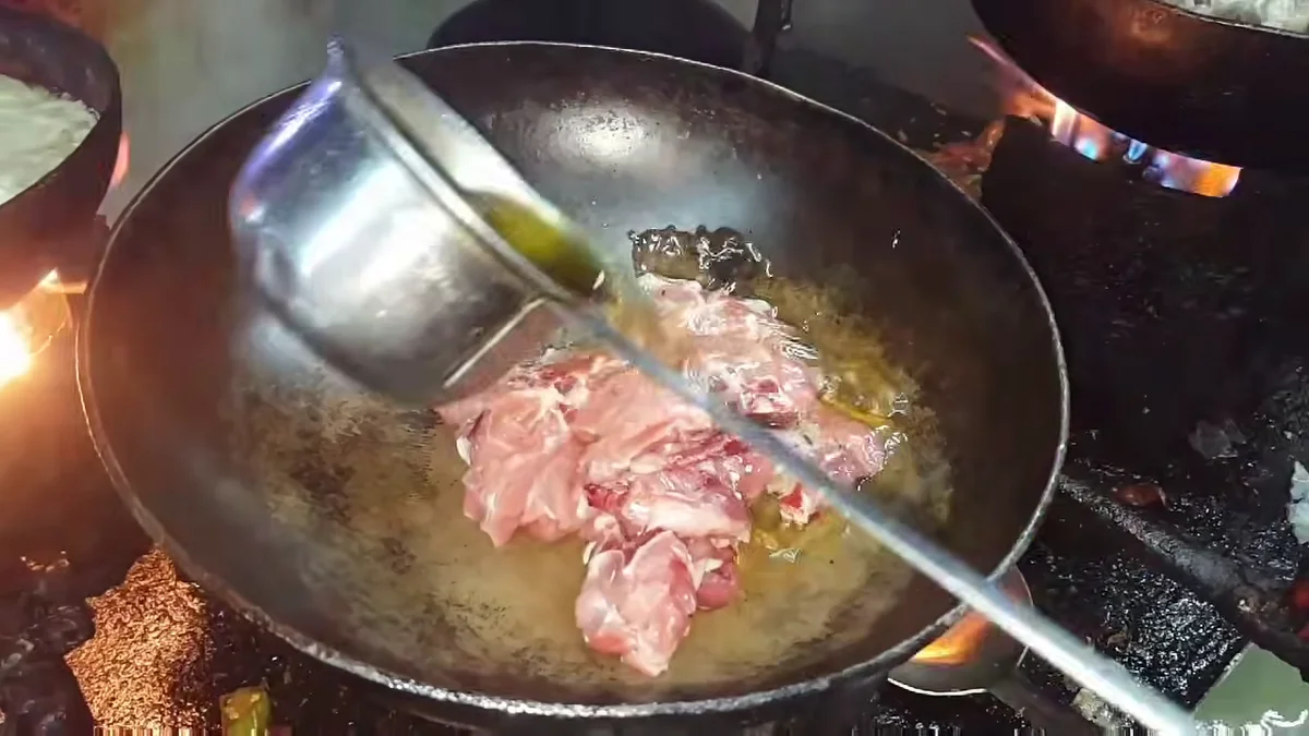 Cooking oil poured over the mutton