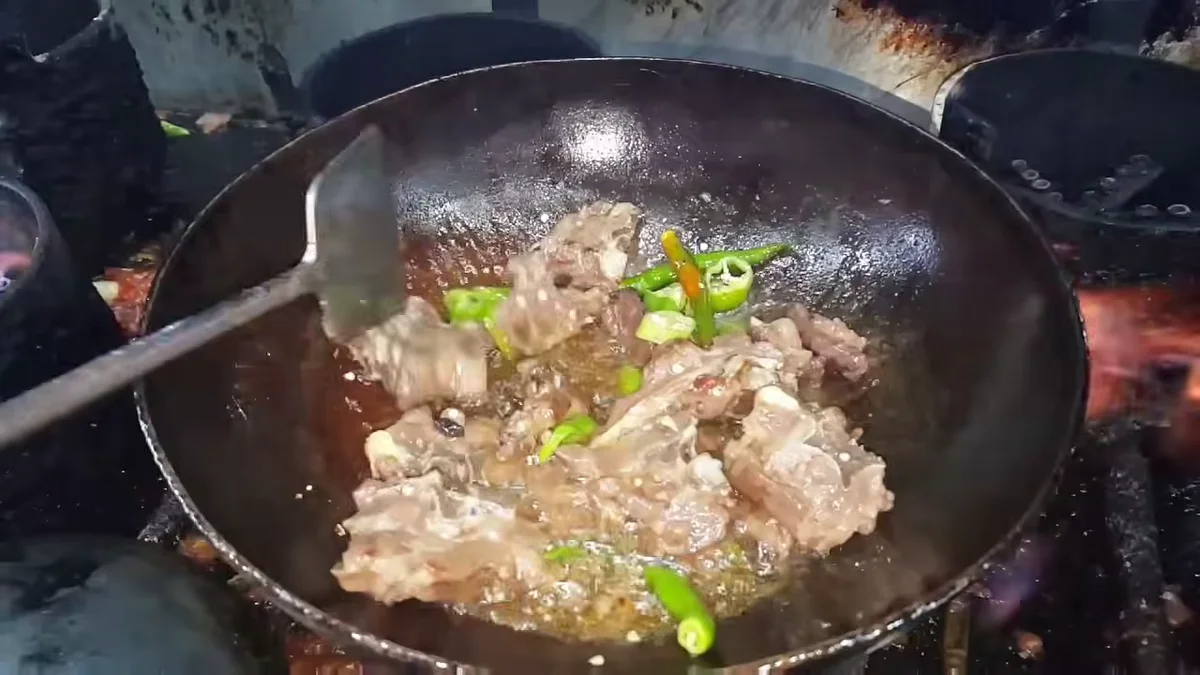 Green chillies added to the mutton