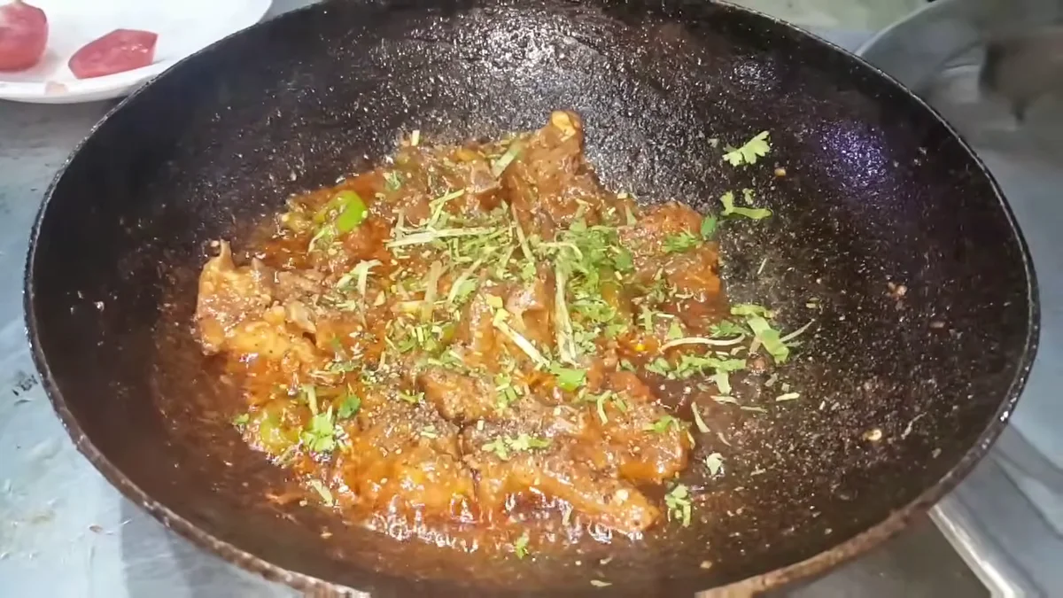 Ginger julienne and coriander on the finished karahi