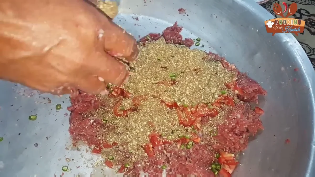 Crushed spices spread over the meat
