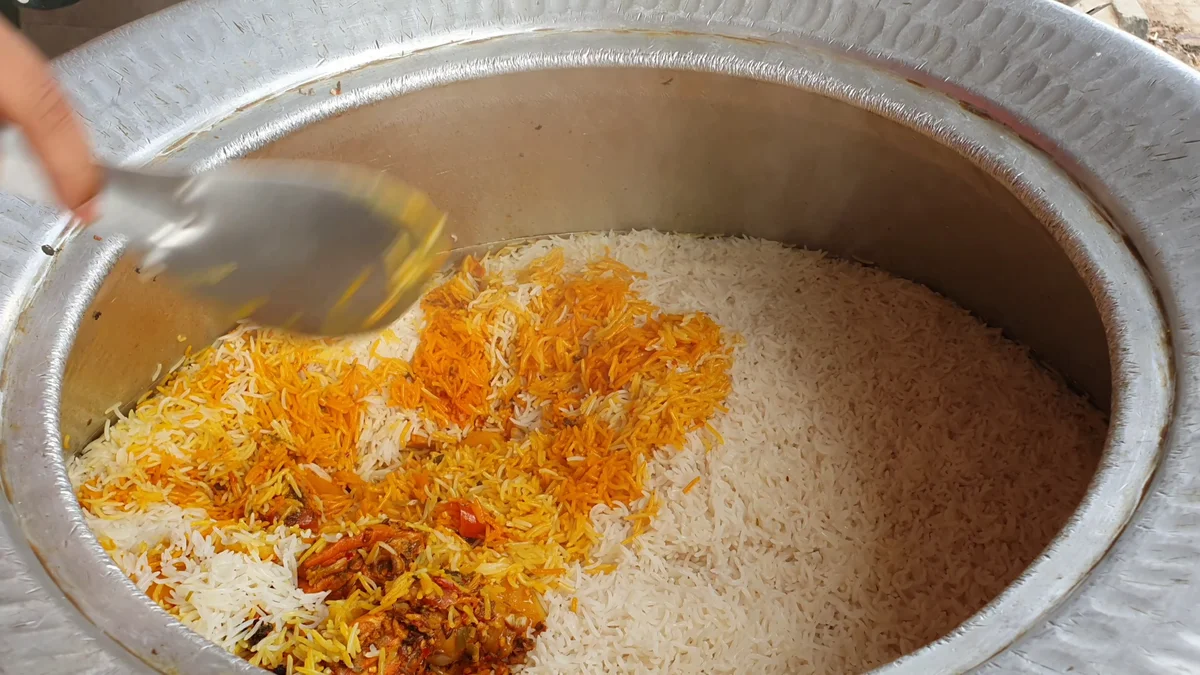 Cooking oil poured over the biryani after dum