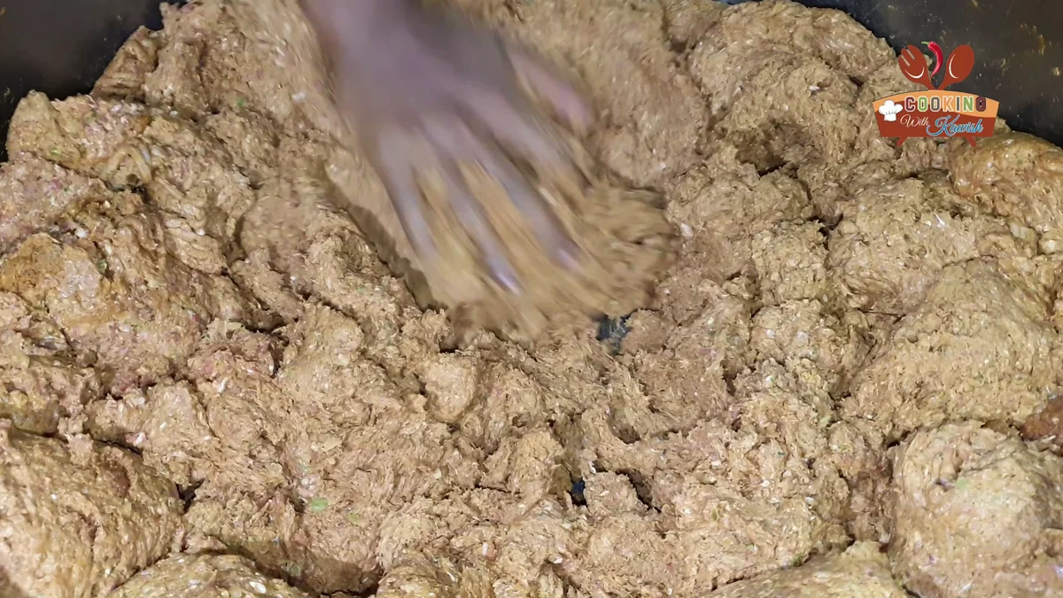 Kneading the ground beef into a smooth kabab mince