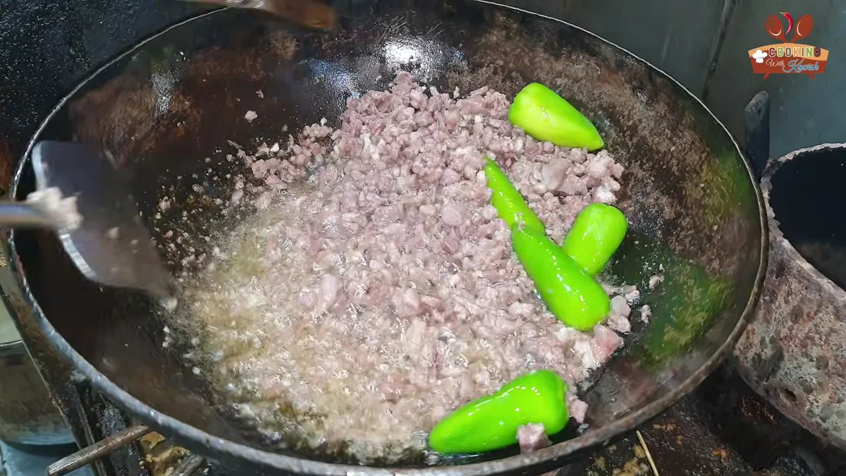 Whole green chillies added to the keema