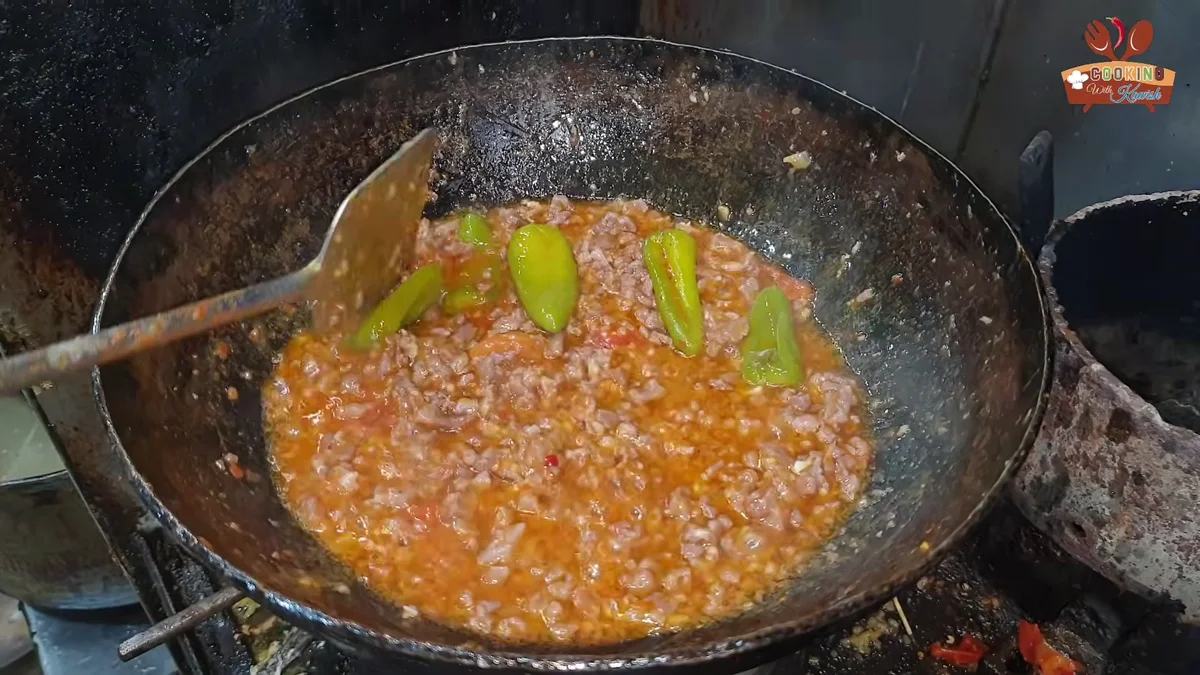 Keema karahi masala thickening in the karahi