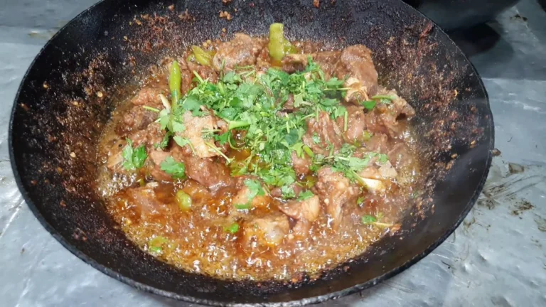 Barohi mutton karahi topped with fresh coriander