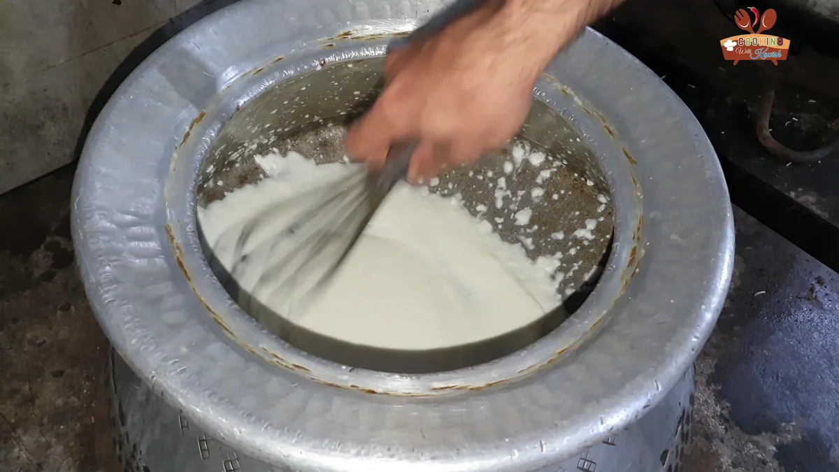 Whisking the yogurt until smooth