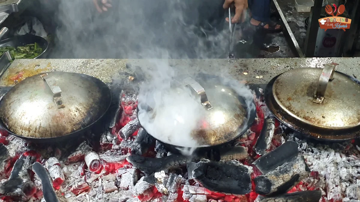 Karahi covered while the charcoal smoke gives the dum