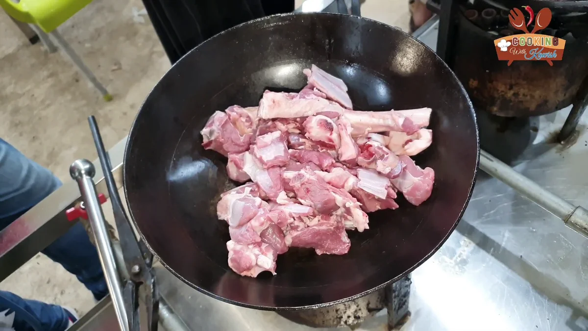 Raw mutton rib pieces in a karahi