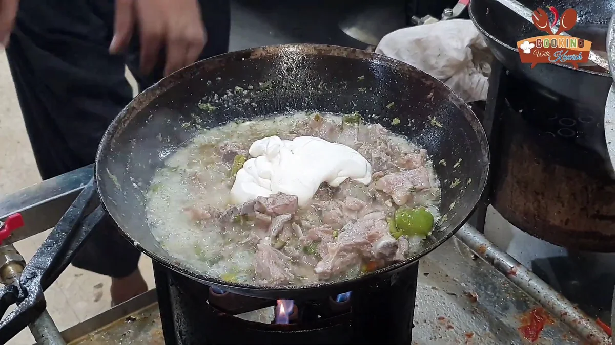 A spoonful of cream added to the creamy karahi gravy