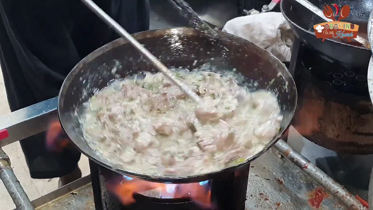 Creamy white gravy thickening around the mutton