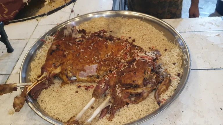 Whole steam-roasted mutton on a bed of rice with boiled eggs