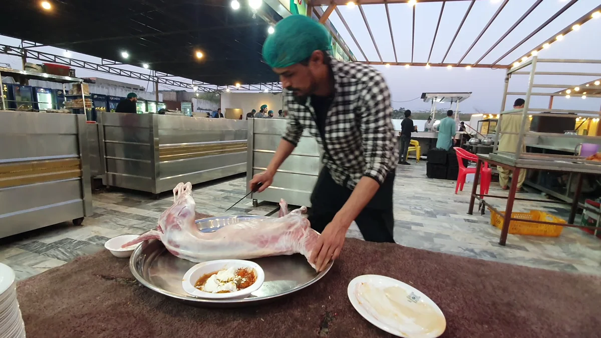 Whole mutton laid out on a tray ready for the masala