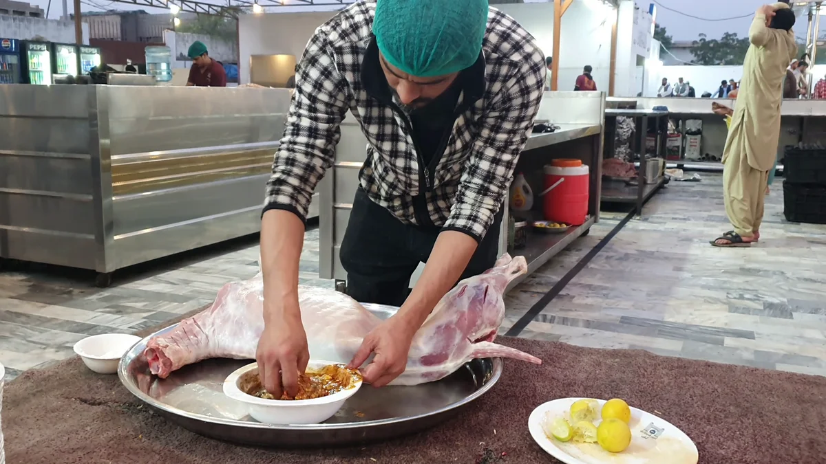 Rubbing the masala all over the whole mutton