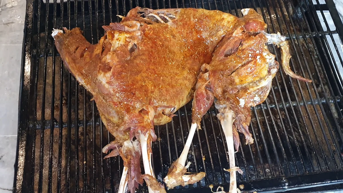 Steamed mutton being grilled over the fire